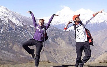 Trekkers posing in front of Himalayan Range